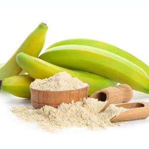 Organic spray-dried banana powder in a bowl, with ripe bananas on the side.